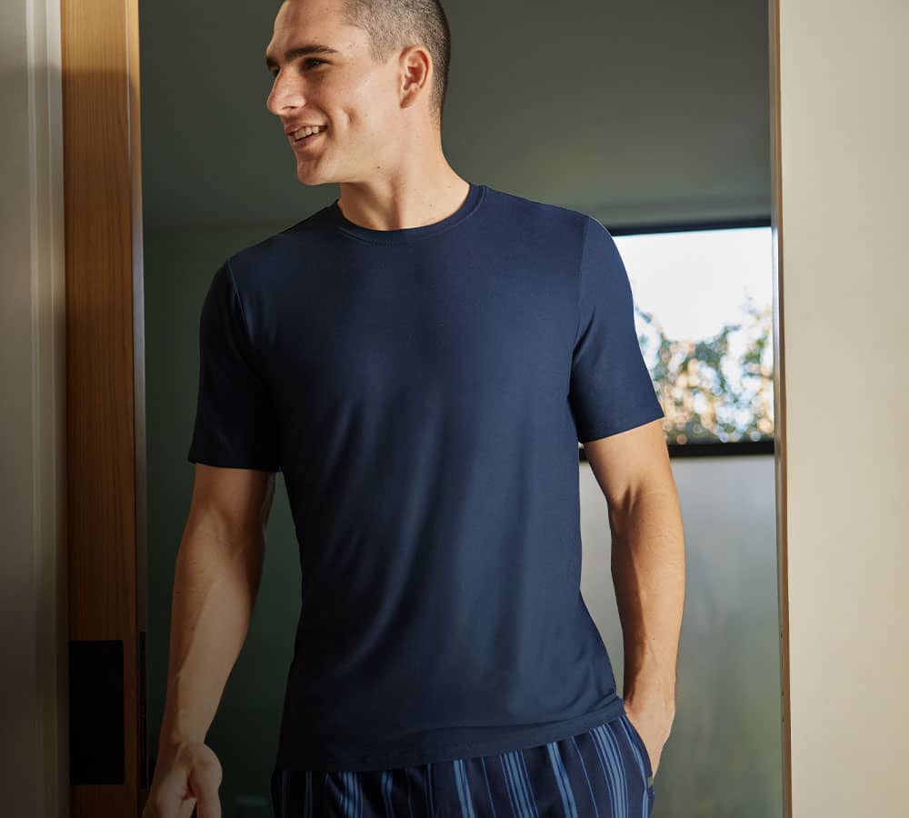 man in house wearing pajamas