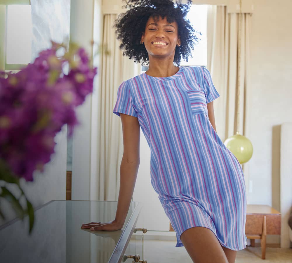 woman wearing striped pajama dress