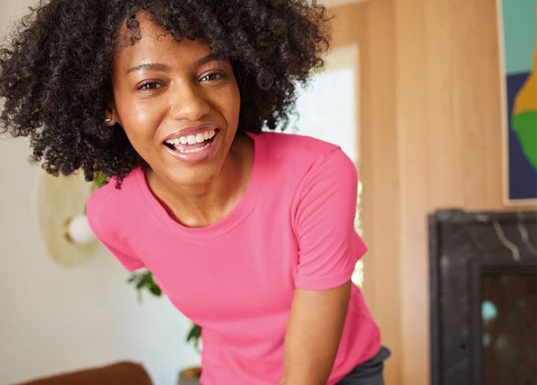 woman wearing a pink top
