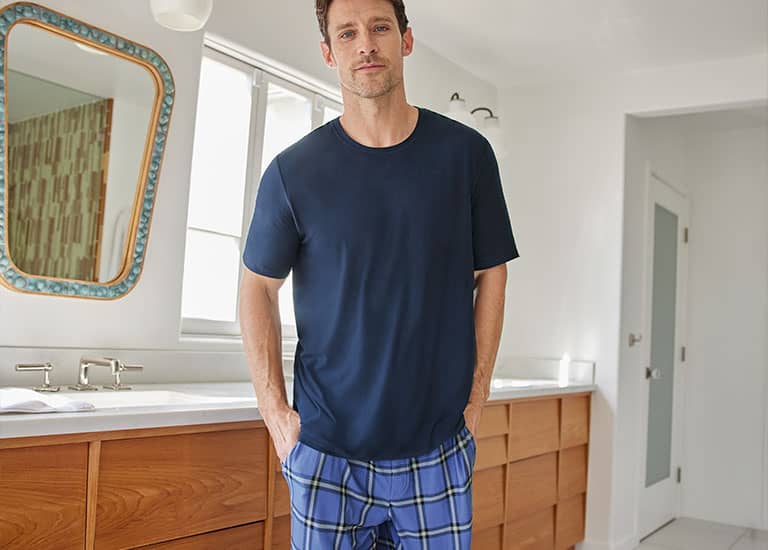 man in pajamas in the bathroom