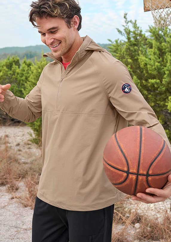 Man Playing Baskletball in Jockey Windebreaker