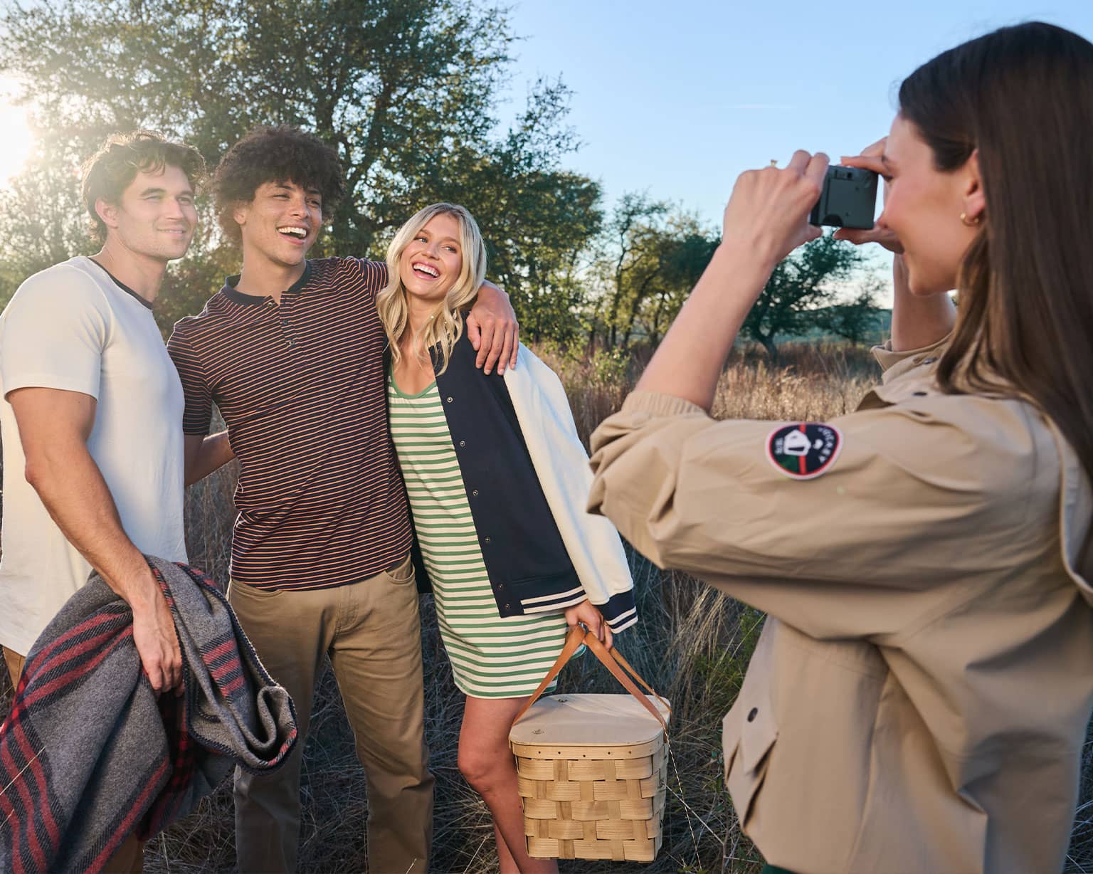 group of people smiling taking a photo together