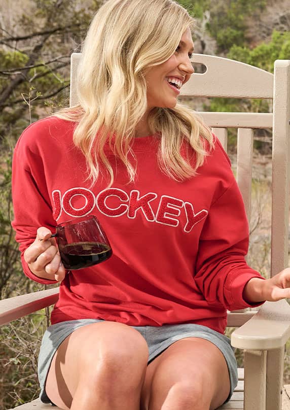 Women sitting in a Jockey Cotton Fleece Sweatshirt