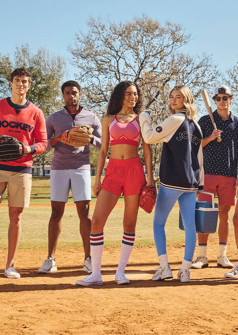 Group of friends playing baseball wearing 1876 collection pieces