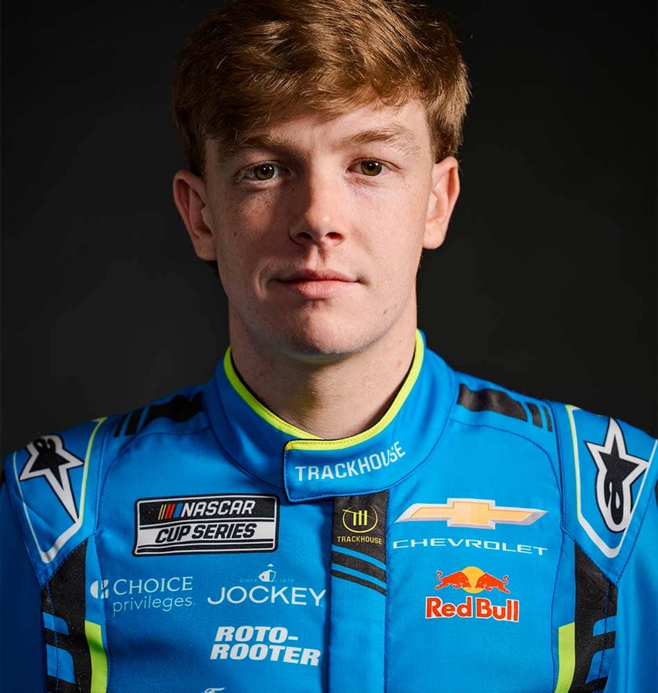Daniel Suarez leaking against a wall
